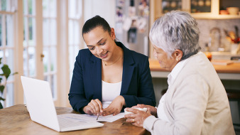 Tax professional helps senior woman with taxes