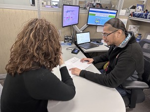 Jaime Villarreal going over a career scope assessment with a client