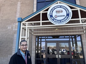 Jaime Villarreal standing in front of Employment Services of Weld County building