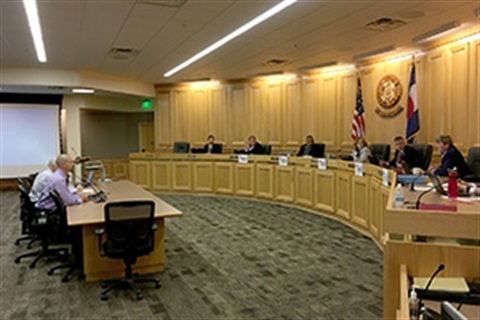Jason Maxey, the county's first director of the Weld County OGED sitting in front of the Weld County Board of Commissioners.