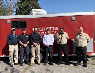 Hurricane Helene response team in front of emergency truck 