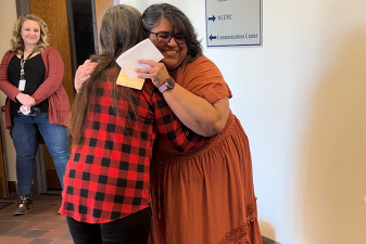 A citizen hugging a member of the WCRCC in 2023.