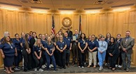 Weld County nurses with county commissioners following a proclamation for National Nurses Month.