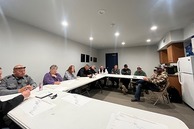 Public works crews and community members meet for an update on the road project.