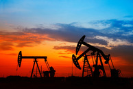 Pump jacks against the morning sun. 