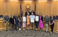 NACO award recipients standing with the Weld County Board of Commissioners.