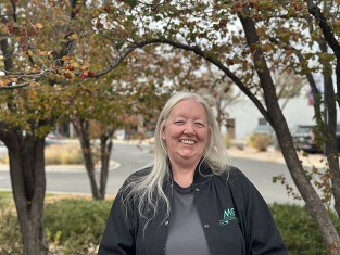 Wanda surrounded by nature, smiling