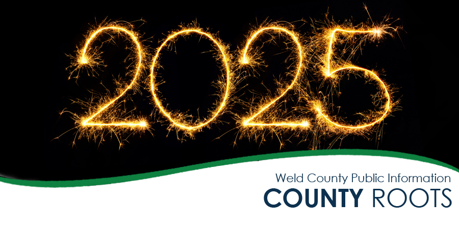 Bright golden sparklers forming the number 2025 against a black background