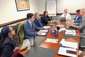 Commissioners Maxey and Ross sitting with members of the Federal Aviation Administration. 