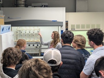 Katrina Alsum giving a tour of the lab