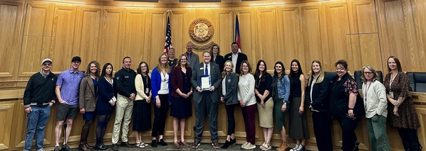 Child Welfare staff and community members receive proclamation for Foster Care Month from Weld County commissioners