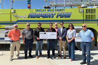 Commissioner Ross and Gabe Evans with airport board members 