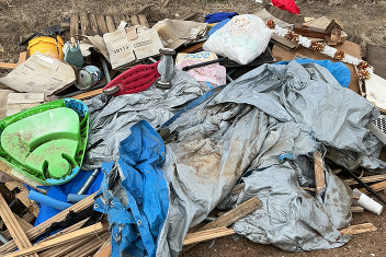 Tarps and trash in the county right of way. 