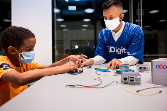 Man and child work on a project together