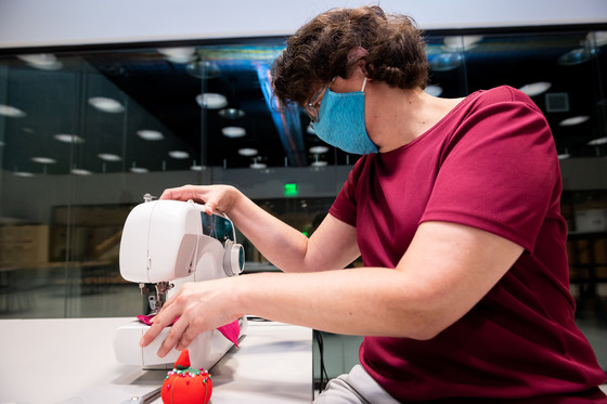 Woman works with a sewing machine
