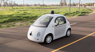 Picture of a white car that is an autonomous vehicle
