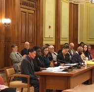Mat McCollough, Christina Mitchell, and Alison Whyte sit at a table during the Budget Oversight Hearing