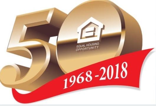 A large gold number 50 with the words equal housing opportunity in white infront of it. 1968-2018 are in white font infront of a red flag