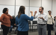 two people are signing