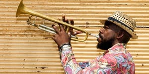 Picture of a man playing the trumpet. 