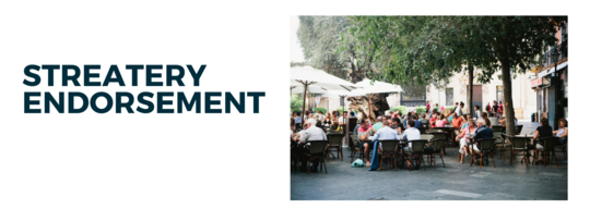 Friends eating and drinking on a crowded patio