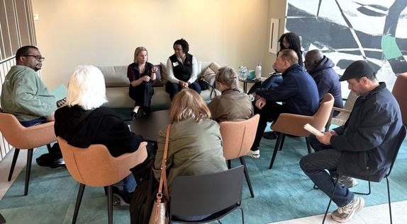 Directors Kershbaum and Cozart speak with meeting attendees