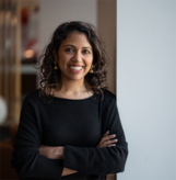 Smiling photo of Radhika Mohan facing the camera