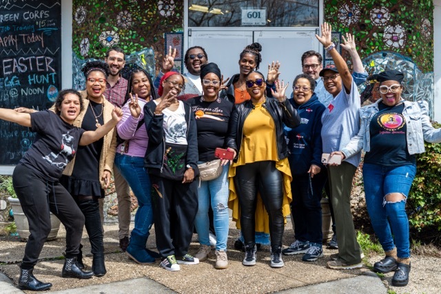 The Coalition staff posing outdoors alongside OP staff