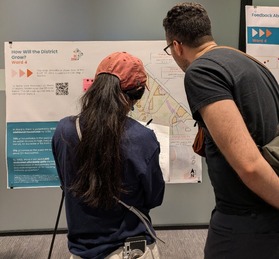 Two meeting attendees consider proposed density increases for sections of Ward 4 and give their thoughts