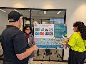 Attendees view information and questions about small area plans and share feedback