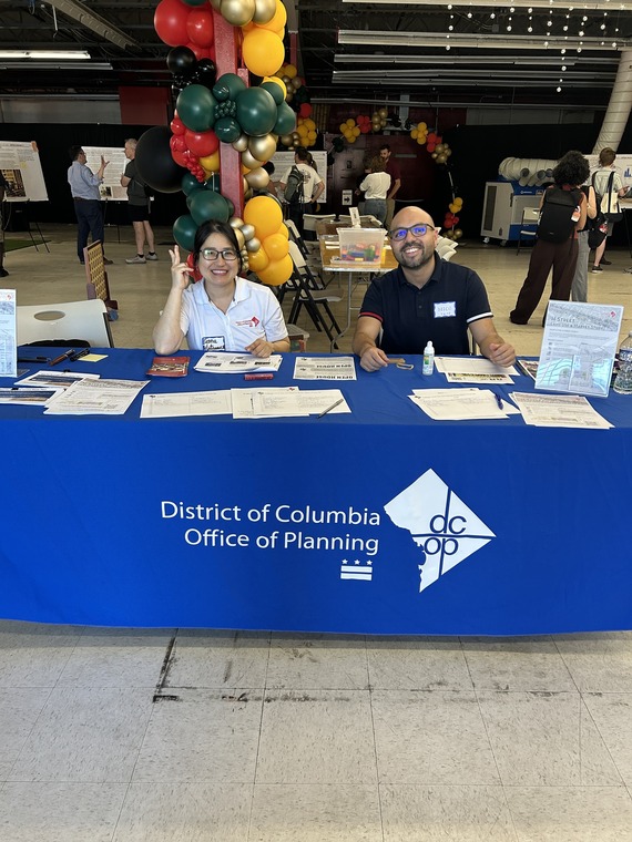 Photo of two staff members at the H St Open House.
