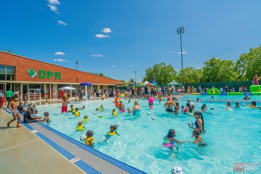 Photo of community members celebrating the grand reopening of the Rosedale outdoor pool.