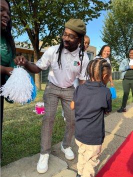 CM White with a student 