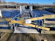 Broad Creek tidal dock at Records Pond boarded off with ramp closure sign