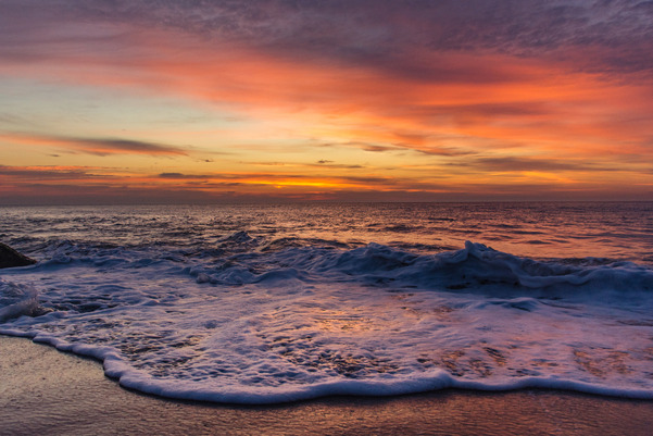 Ocean view under a sunset at Cape Henlopen State Park beach
