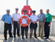 Group displaying one of the new life rings at Woodland Beach.