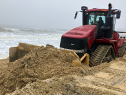 Sand plow at Indian River Inlet