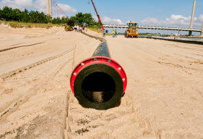 Sand bypass pipe resting on the sand