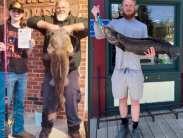 Jason Wise holds his 33-pound, 15.68 ounce Flathead Catfish and Dyllan Rust holds a 15-pound 8-ounce Northern Snakehead