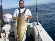 Logan Smith aboard the boat Blue Betty II with his new state record Golden Tilefish that weighed 56 pounds, 3.2 ounces
