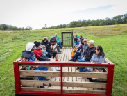 A group enjoys a hayride at a state park.