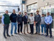 Secretary Greg Patterson and staff from Big Chill Beach Club pose for photograph with their award plaque. 