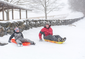 Father and son sledding in Brandywine Creek State Park