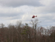 A helicopter contracted by DNREC Mosquito Control sprays for Woodland Pool mosquitoes