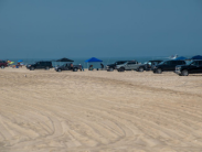 Trucks and sport utility vehicles line up at 3 R's at Delaware Seashore State Park