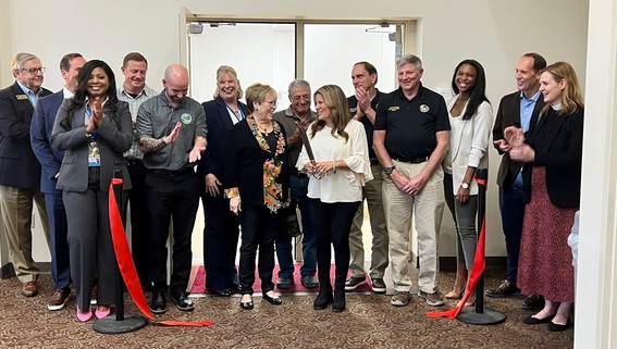 broup ribbon cutting photo