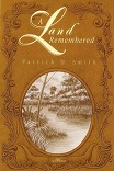 Book Cover A Land Remembered by Patrick D. Smith -Filigree around edge oval containing picture of swamp