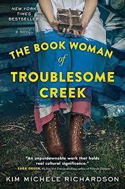 Book Cover: The Book Woman of Troublesome Creek by Kim Michele Richardson Image of Woman holding book