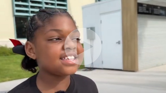 a girl explaining something on camera