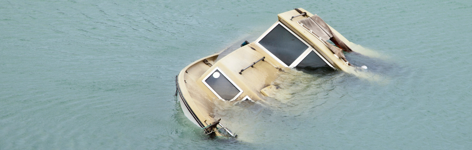 a boat sinking in the water